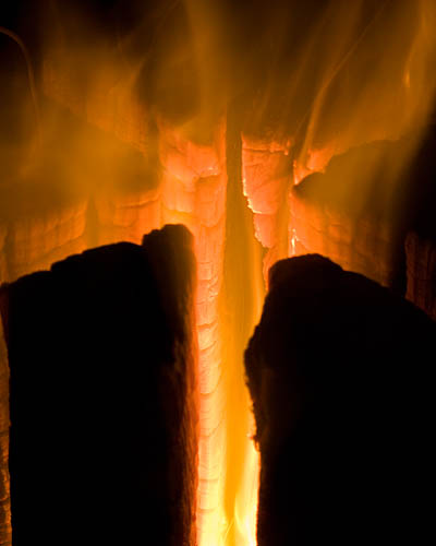Fire Log ignited and burning well. - Ice Raven - Sub Zero Adventure - Copyright Gary Waidson, All rights reserved.